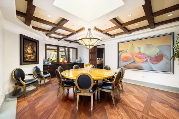 a view of a patio with table and chairs and potted plants