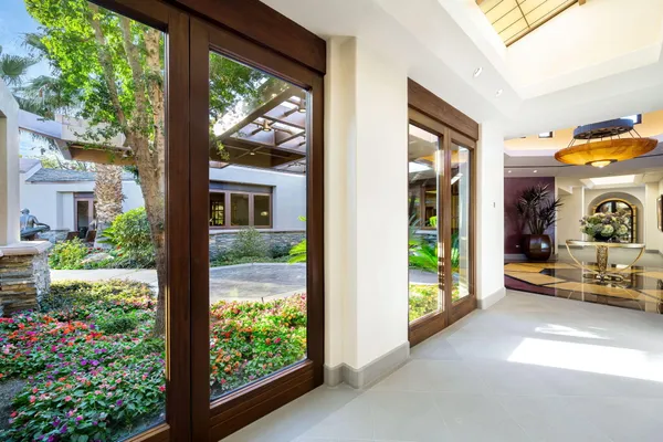 a backyard of a house with table and chairs