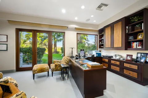 a view of a pathway covered with flower plants