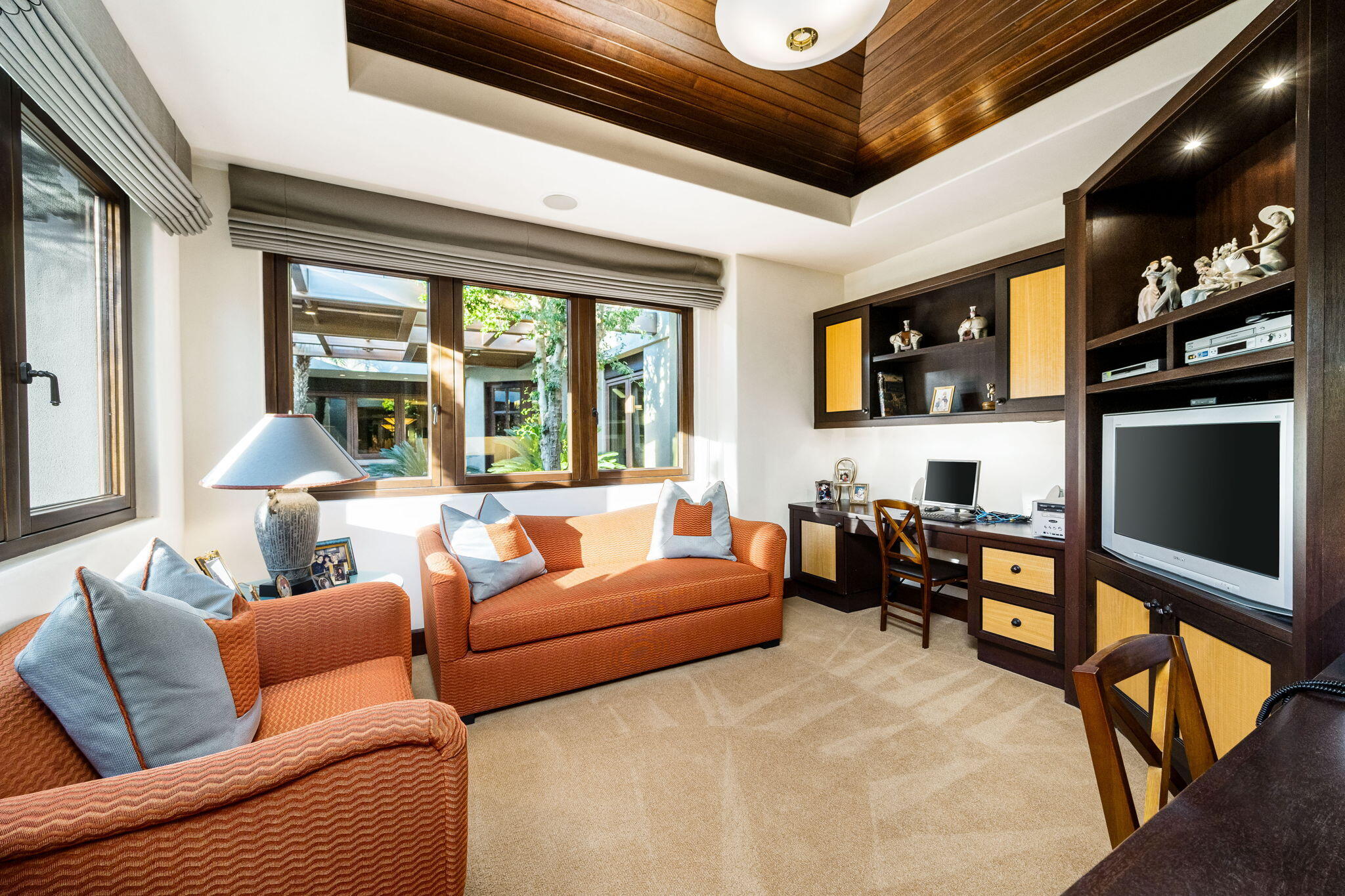 100 Lantana View Palm Desert, CA 92260 - Photo 40 of 121 a living room with furniture a flat screen tv and a large window