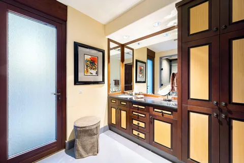 a living room with furniture a fireplace and a large window