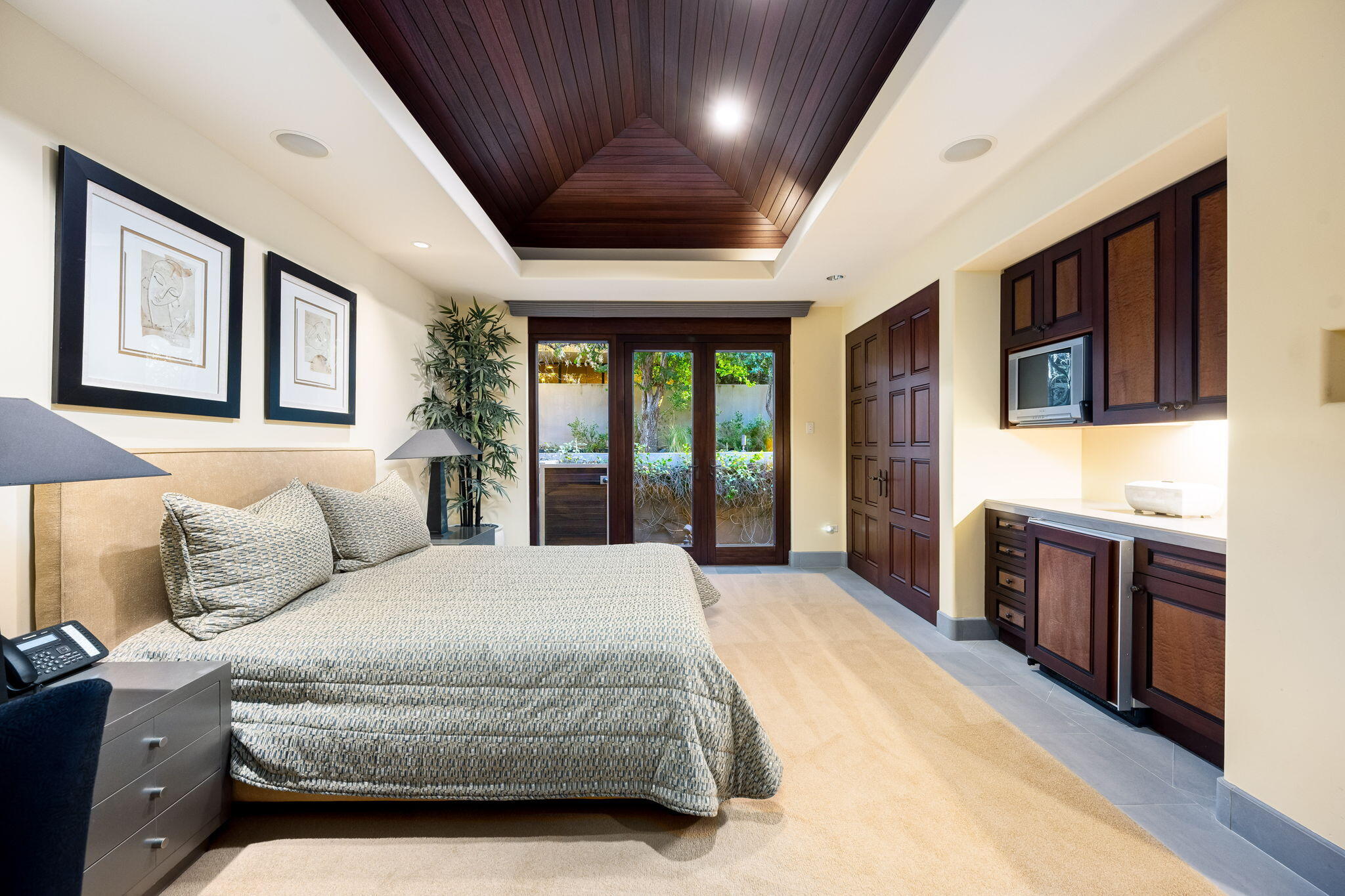 100 Lantana View Palm Desert, CA 92260 - Photo 44 of 121 a spacious bedroom with a large bed and a flat tv screen