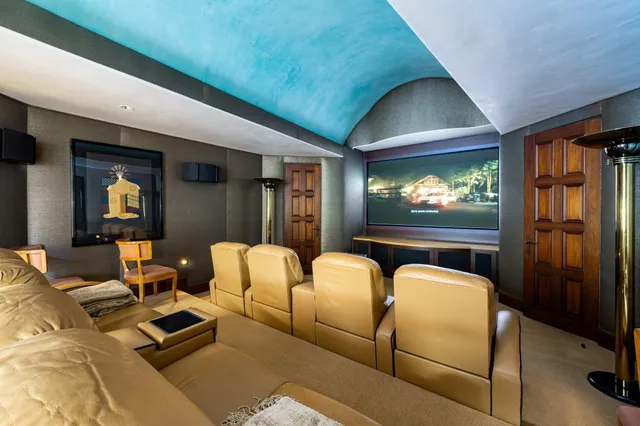 a view of a house with swimming pool and sitting area