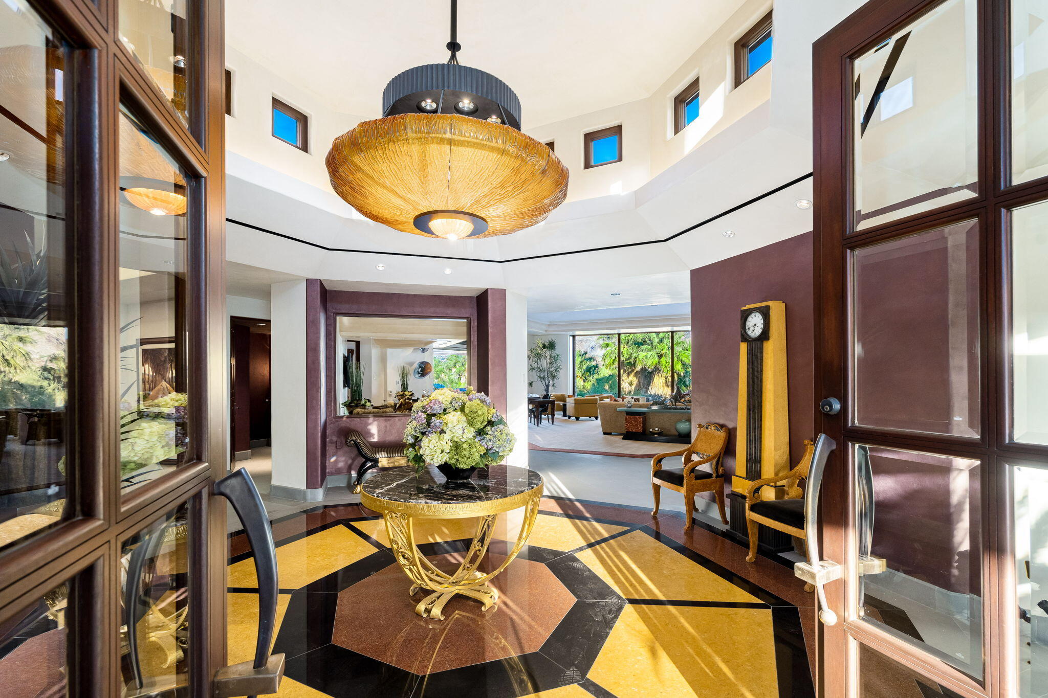 100 Lantana View Palm Desert, CA 92260 - Photo 5 of 121 a view of a dining room with furniture a chandelier and wooden floor