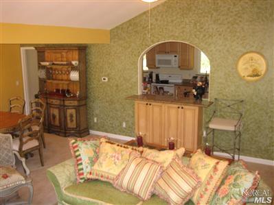 6495 Bennett Valley Road Santa Rosa, CA 95404 - Photo 11 of 11 a bedroom with a bed a mirror and balcony view
