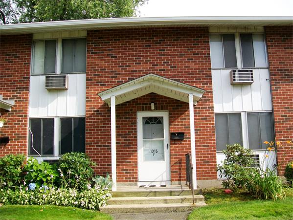 1078 Allen Street, Unit F Springfield, MA 01118 - Photo 1 of 23 a front view of a house with garden