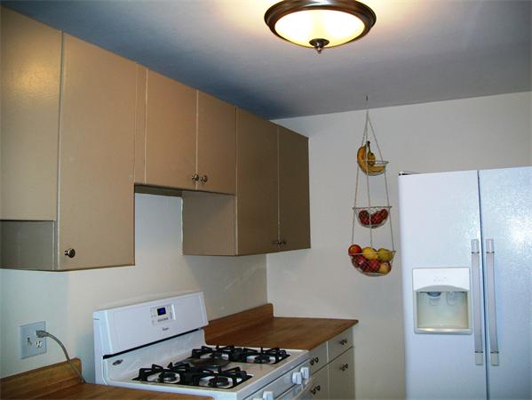 1078 Allen Street, Unit F Springfield, MA 01118 - Photo 11 of 23 a kitchen with a refrigerator and a stove