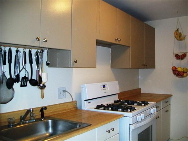 1078 Allen Street, Unit F Springfield, MA 01118 - Photo 13 of 23 a kitchen with sink a stove and cabinets