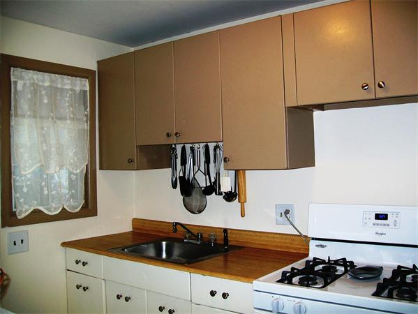 1078 Allen Street, Unit F Springfield, MA 01118 - Photo 14 of 23 a kitchen with a sink and cabinets