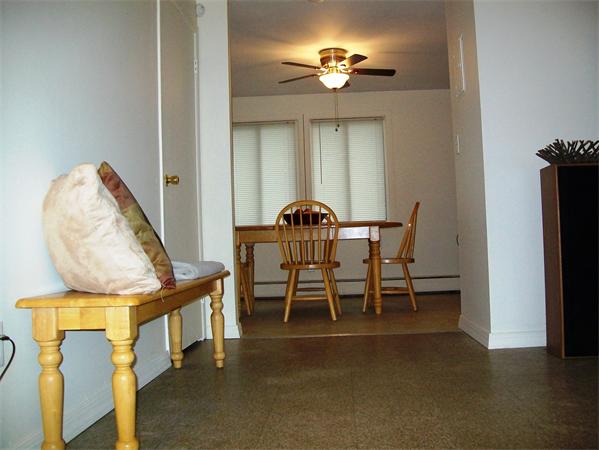 1078 Allen Street, Unit F Springfield, MA 01118 - Photo 7 of 23 a view of a dining room with furniture and chandelier