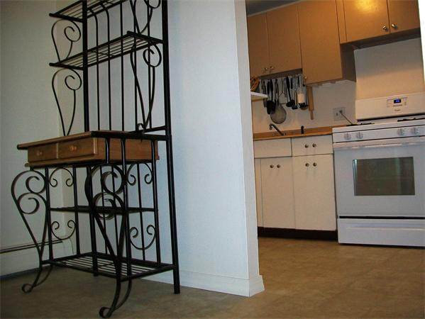 1078 Allen Street, Unit F Springfield, MA 01118 - Photo 10 of 23 a kitchen with a white cabinets and white appliances