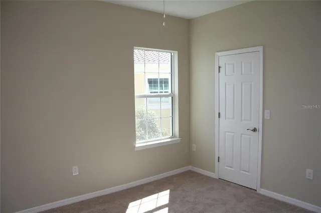 an empty room with windows