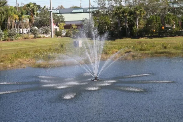 a view of a yard with wooden fence