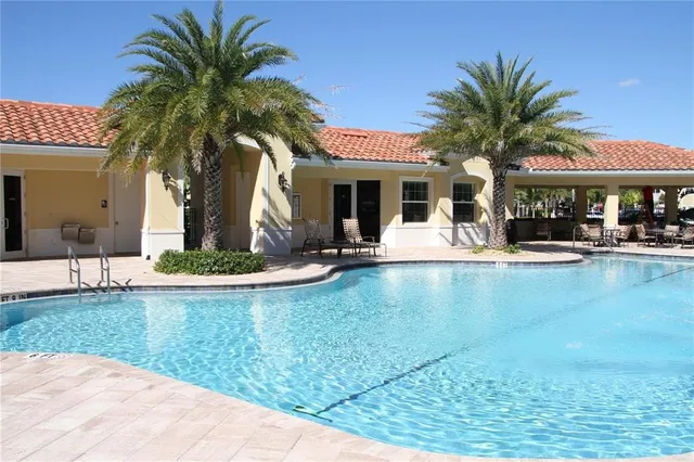 a view of a swimming pool with a patio