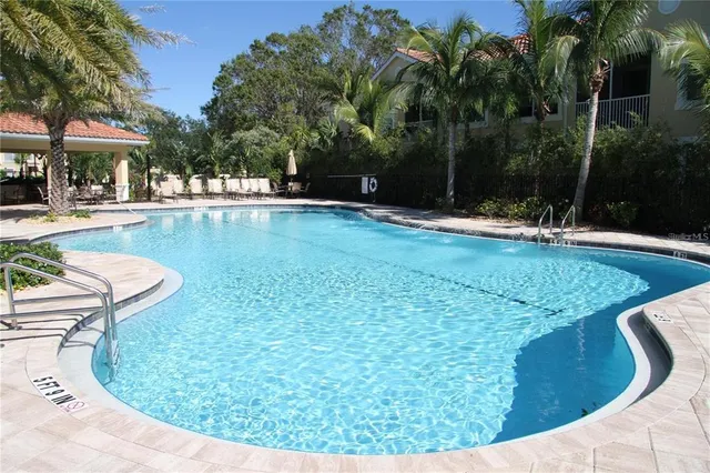 a view of a swimming pool with a patio