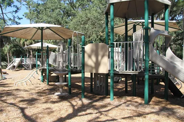 a view of a house with backyard porch and sitting area