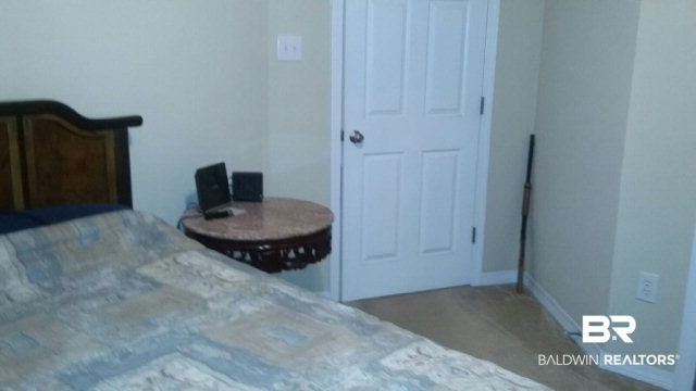 8877 Fall Court Mobile, AL 36695 - Photo 21 of 27 This bedroom gets plenty of natural light and has a large closet.