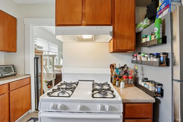 a kitchen with a stove and cabinets