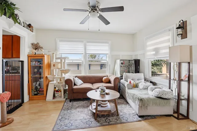 a living room with furniture or couch and a large window