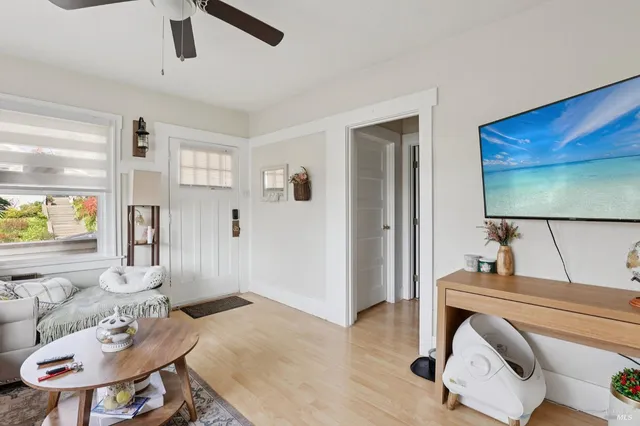 a living room with furniture and a flat screen tv