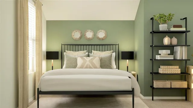 a bedroom with a bed and painting on the wall