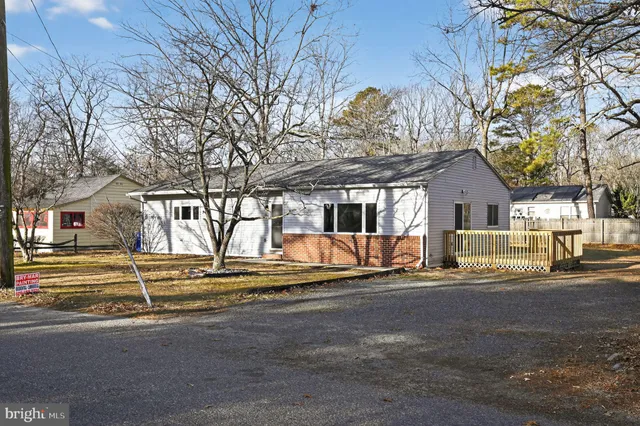 a house with trees in front of it