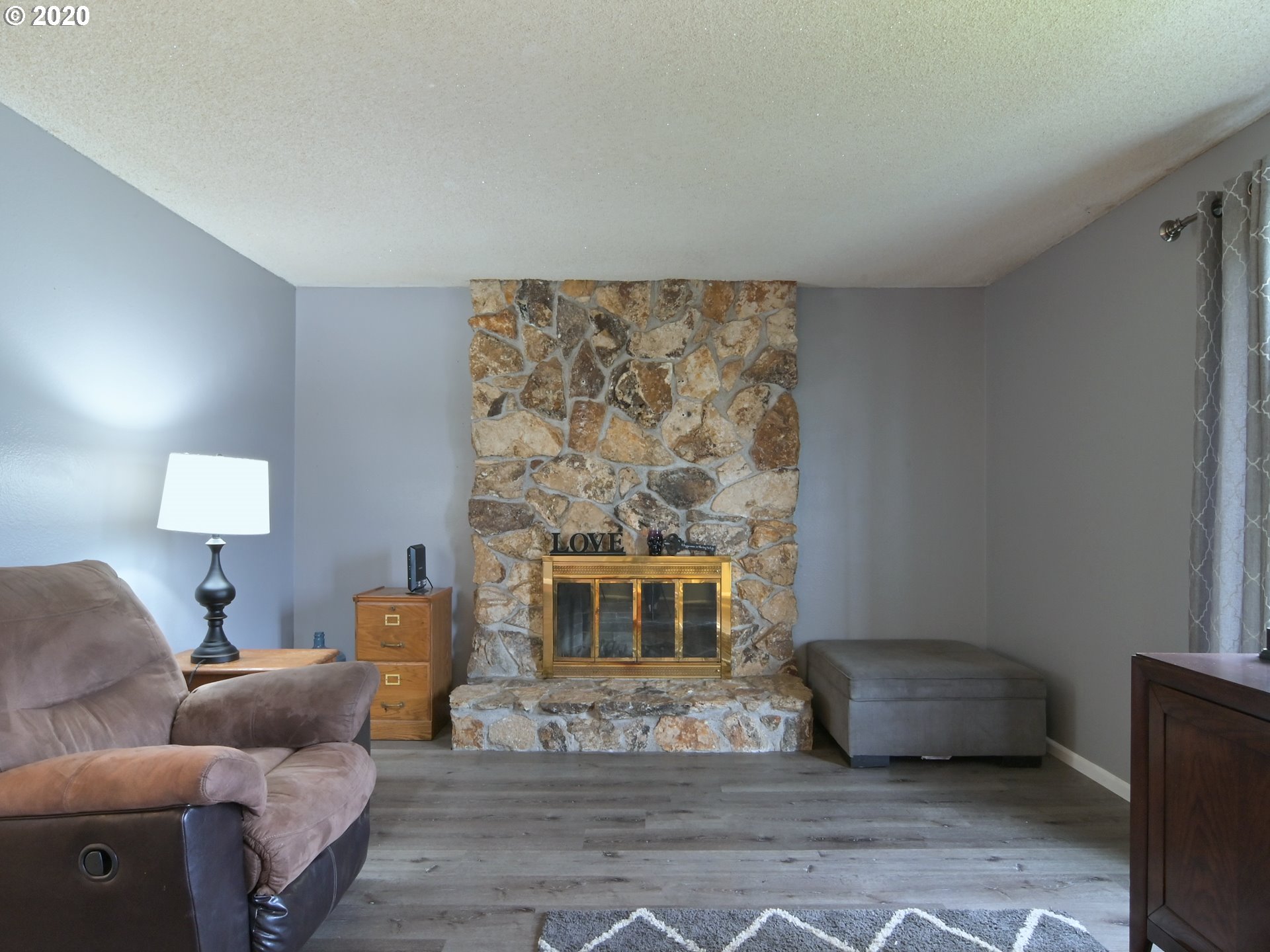 2230 8th Street Springfield, OR 97477 - Photo 7 of 32 a living room with furniture and a fireplace