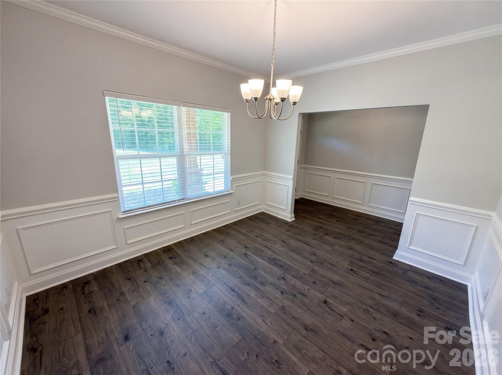 4918 Griffith Road Monroe, NC 28112 - Photo 6 of 17 a view of empty room with wooden floor and fan
