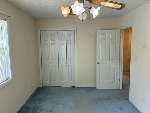 a bathroom with a shower and a window