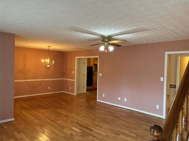 a kitchen with stainless steel appliances granite countertop a refrigerator and a stove