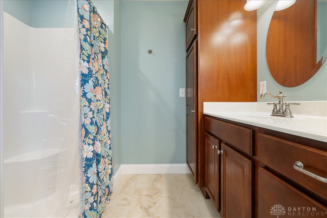 841 Willow Road Springfield, OH 45502 - Photo 23 of 64 This bathroom features practical storage and a clean, inviting design.