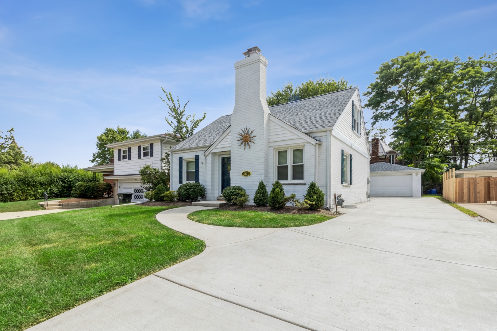 1621 West Talcott Road Park Ridge, IL 60068 - Photo 1 of 26 a front view of a house with a garden and plants