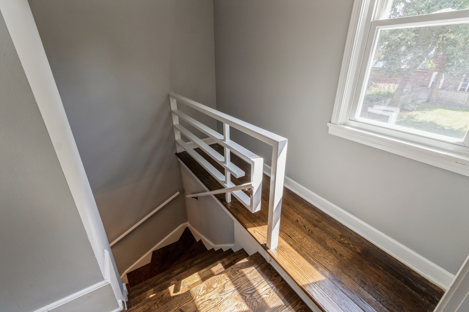1621 West Talcott Road Park Ridge, IL 60068 - Photo 12 of 26 a view of an empty room with wooden floor and a window