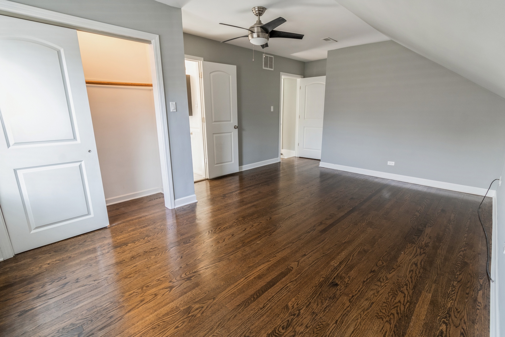1621 West Talcott Road Park Ridge, IL 60068 - Photo 13 of 26 an empty room with wooden floor and door