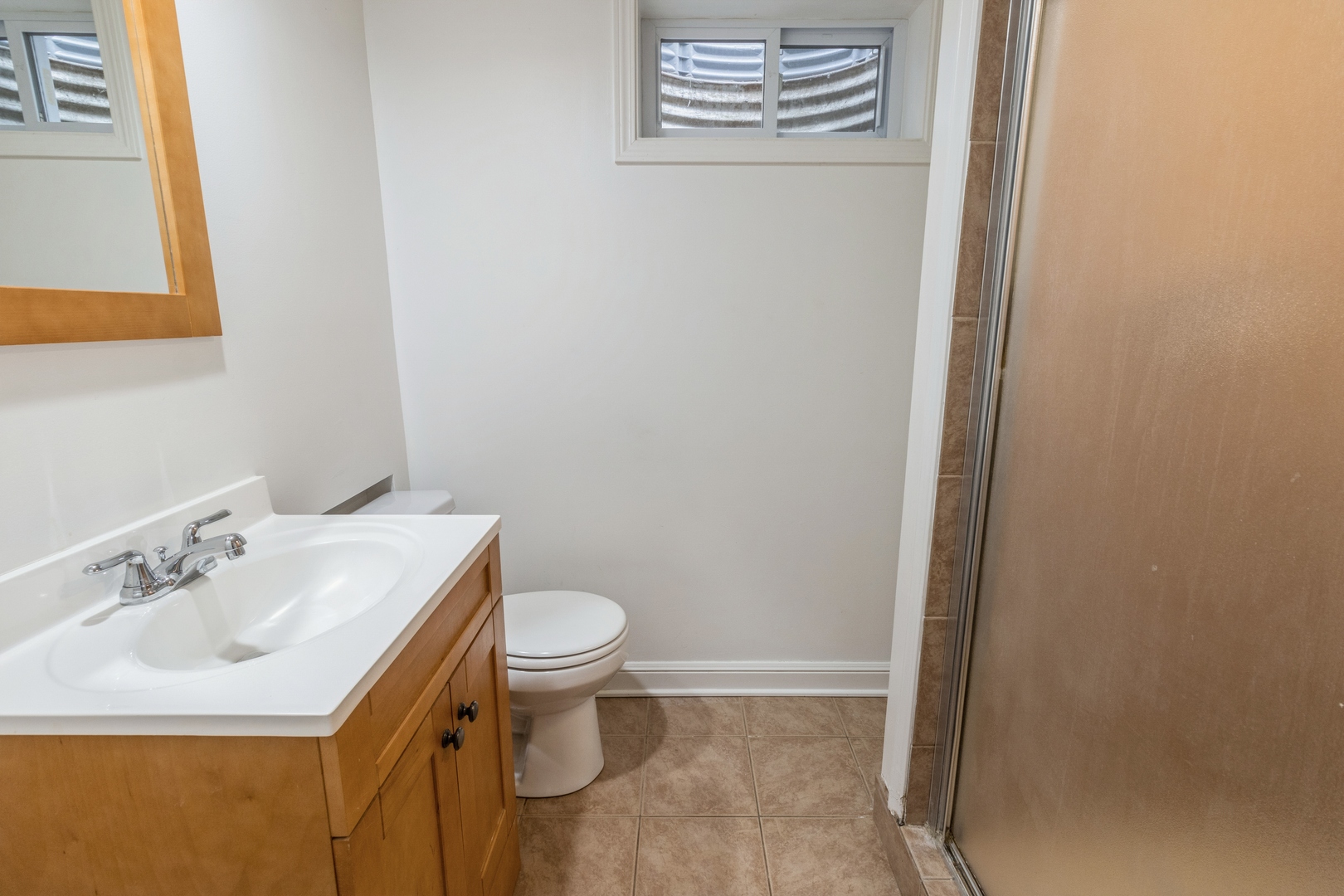 1621 West Talcott Road Park Ridge, IL 60068 - Photo 20 of 26 a bathroom with a sink a toilet and a mirror