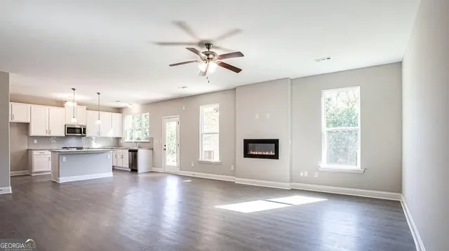 a view of a kitchen with a sink and a window