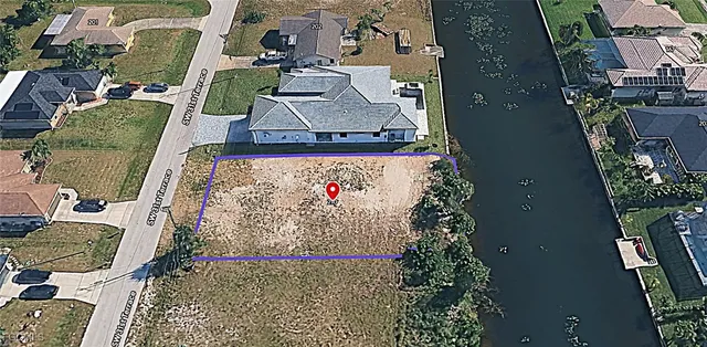 an aerial view of a house with a lake view