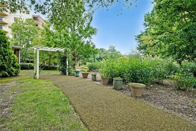 a view of a backyard with sitting area