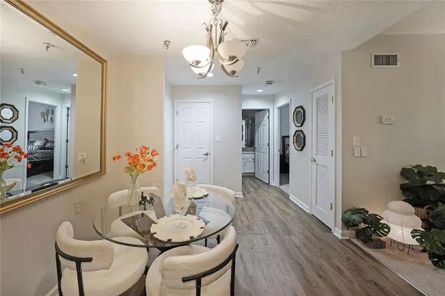 a dining room with furniture and wooden floor