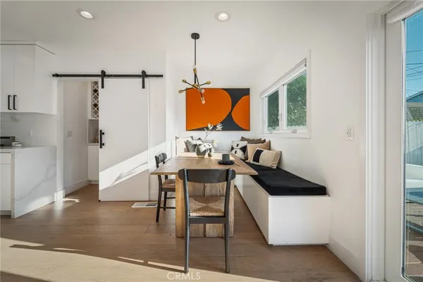 a view of kitchen with furniture and wooden floor