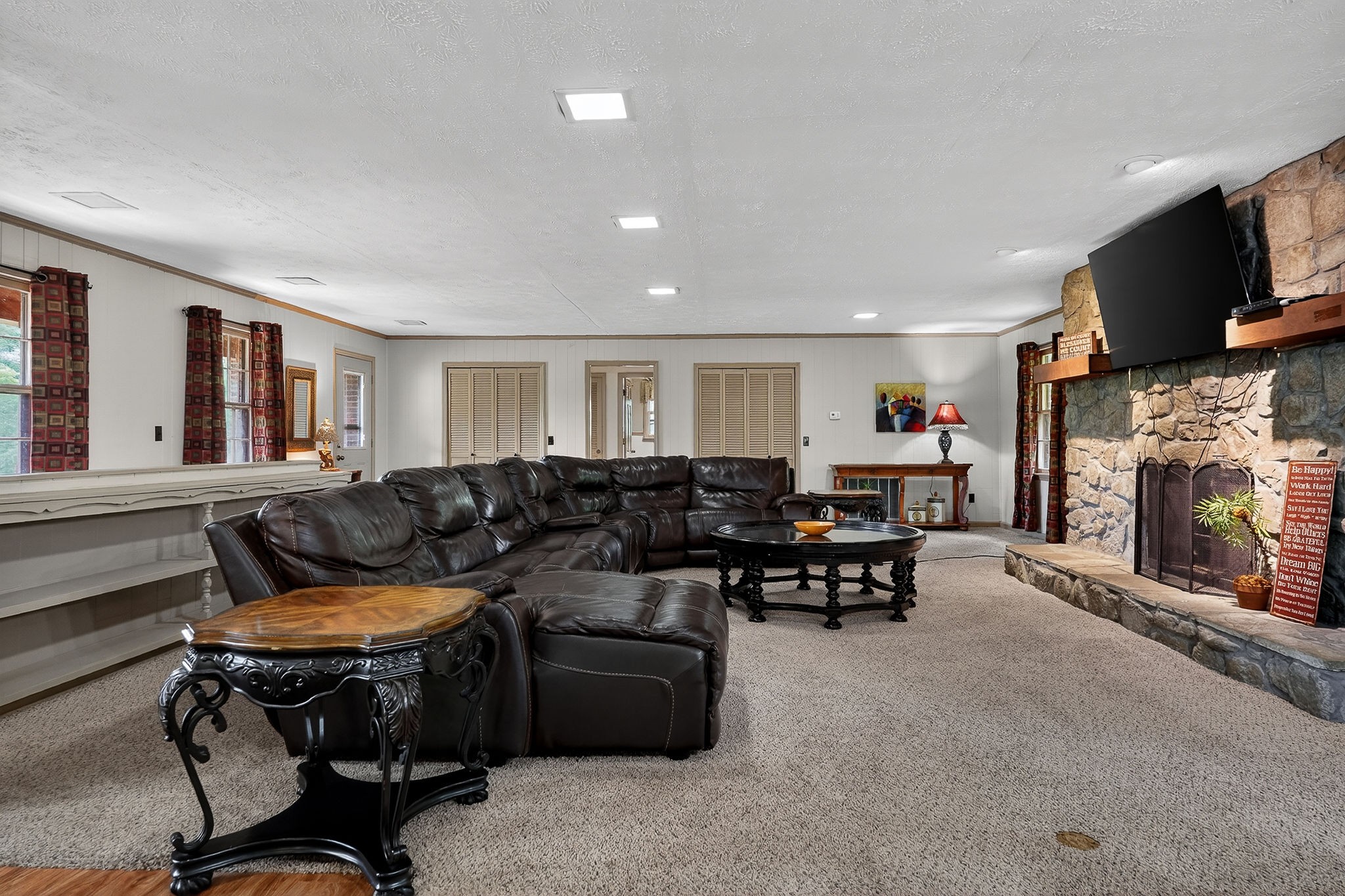 5642 Pates Ford Road Smithville, TN 37166 - Photo 3 of 32 a living room with furniture fireplace and a flat screen tv