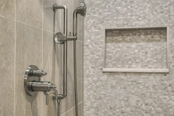 a close view of a utility room with dryer and washer