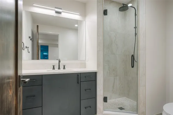 a bathroom with a shower and a bathtub