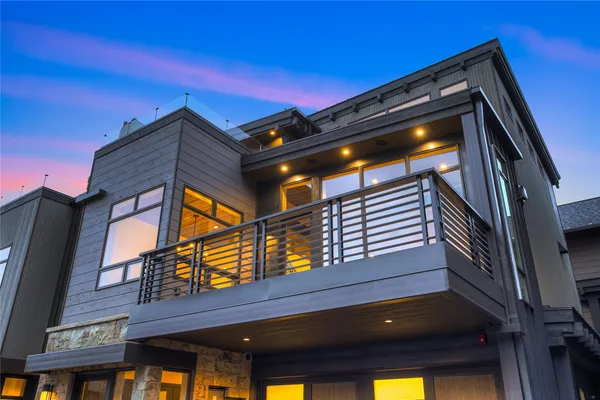 a view of a balcony with furniture and wooden floor