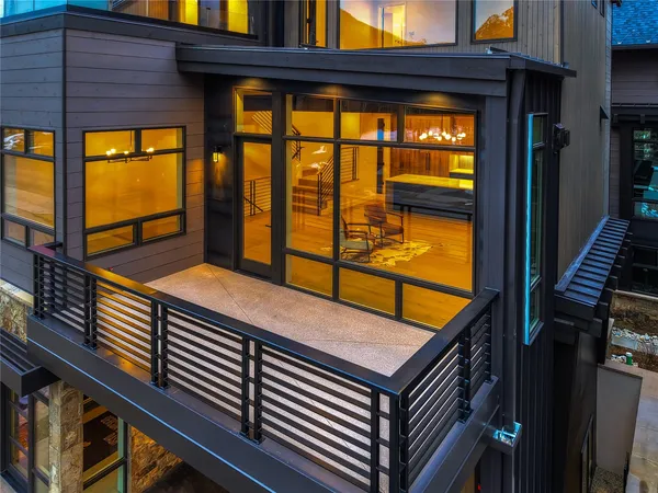 an aerial view of residential houses with outdoor and green space