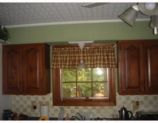 1111 Prospect Road Whitehall, PA 15227 - Photo 4 of 8 Kitchen. NEWER KITCHEN WITH ALL THE APPLIANCES INCLUDING THE MICROWAVE. ACCESS TO PRIVATE REAR PORCH.