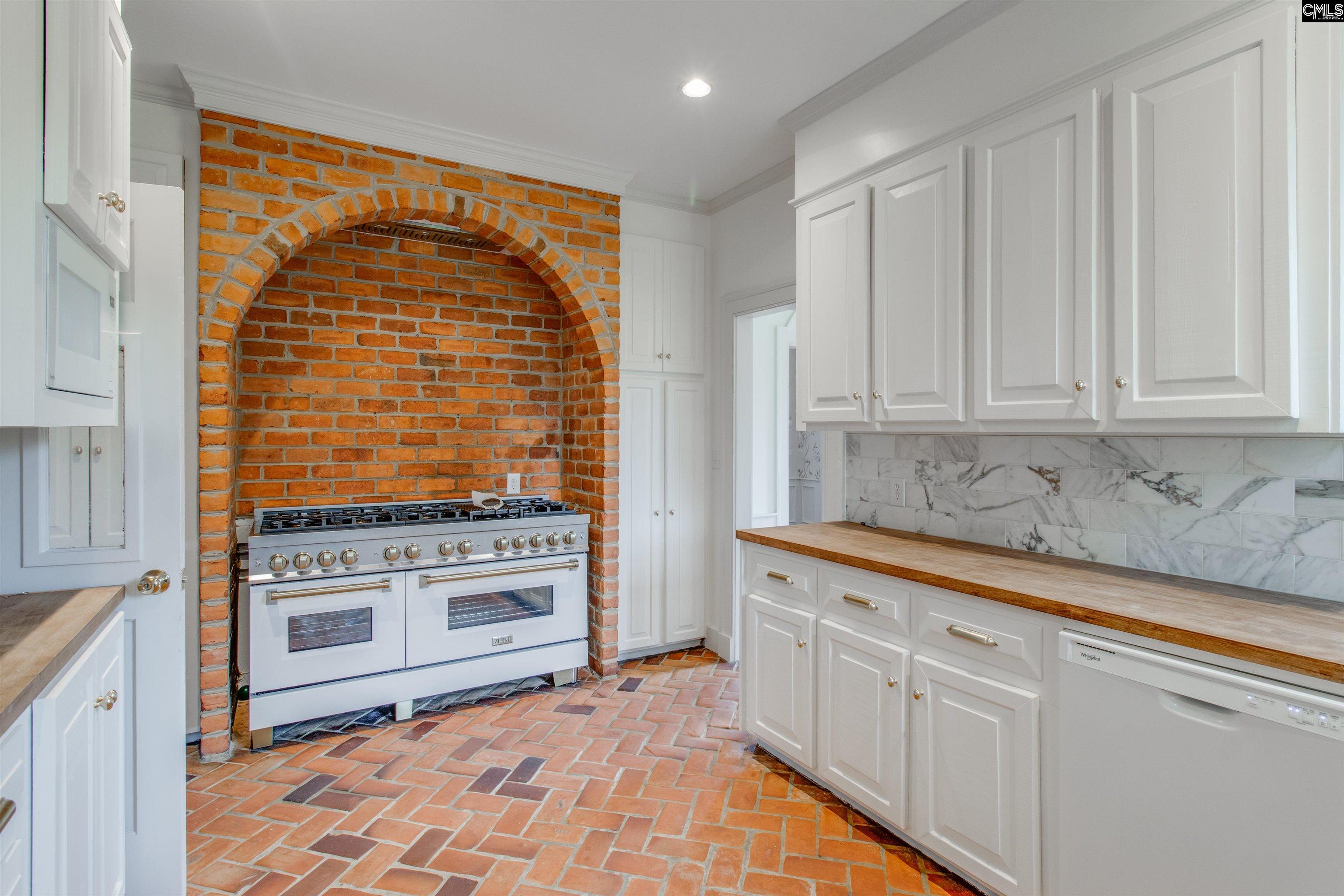 701 Longtown Road Columbia, SC 29229 - Photo 7 of 26 a kitchen with stainless steel appliances granite countertop a stove and a white cabinets
