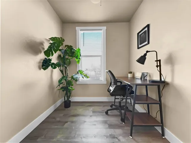 a workspace with furniture and a potted plant
