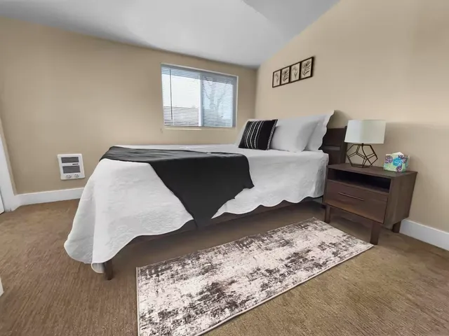 a living room with furniture and window