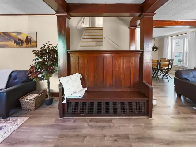 a view of a entryway door of the house and living room